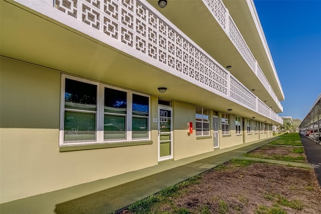 view of side of property featuring stucco siding