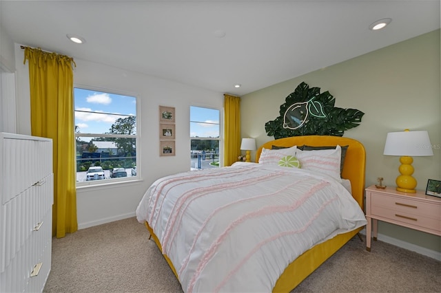 carpeted bedroom featuring recessed lighting and baseboards