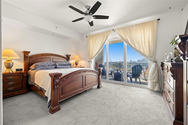 bedroom with carpet floors, ceiling fan, and access to outside