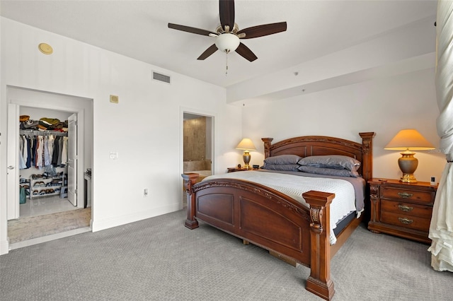 bedroom with baseboards, visible vents, carpet floors, ceiling fan, and a closet