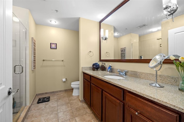 full bathroom featuring visible vents, a shower stall, toilet, and vanity