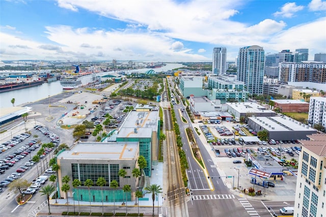 drone / aerial view featuring a view of city and a water view