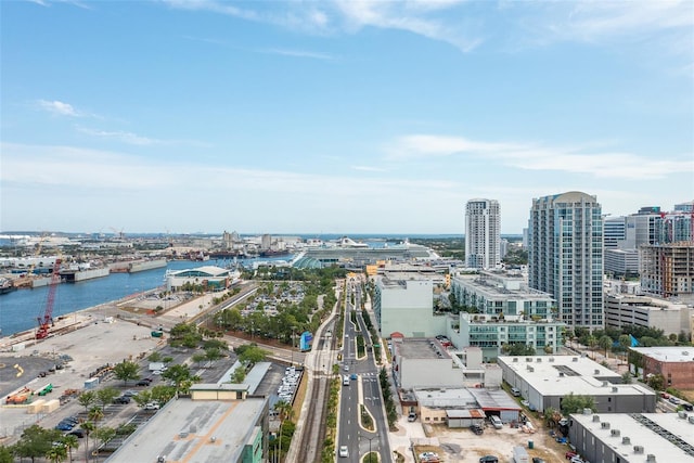 birds eye view of property featuring a city view and a water view