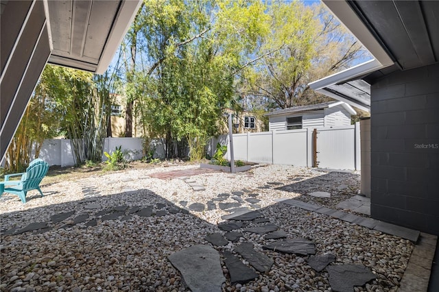 view of yard featuring a patio area and a fenced backyard