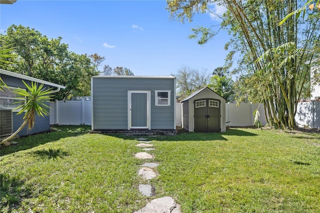 view of shed featuring a fenced backyard