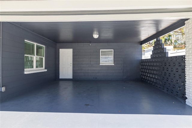 view of patio / terrace featuring a carport and fence