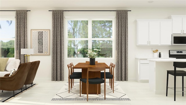 dining room with baseboards