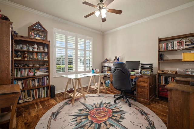 office space with baseboards, crown molding, a ceiling fan, and wood finished floors