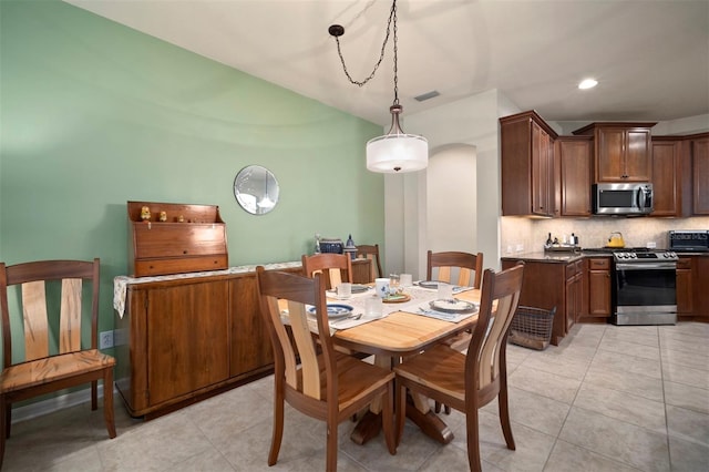 dining space with recessed lighting, visible vents, light tile patterned flooring, and a toaster