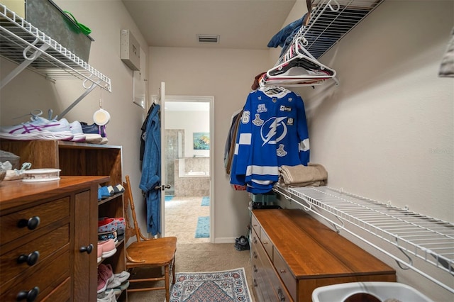 walk in closet with visible vents and carpet flooring