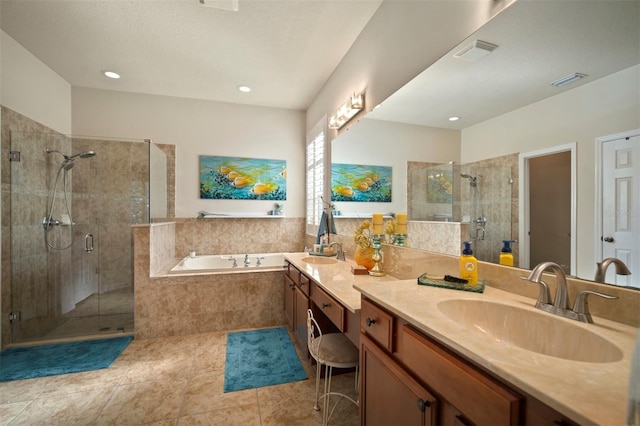 full bath featuring visible vents, a shower stall, a garden tub, and a sink