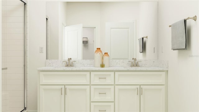 full bathroom featuring double vanity, a shower with shower door, and a sink