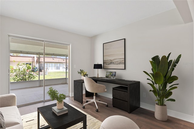 home office featuring baseboards and wood finished floors