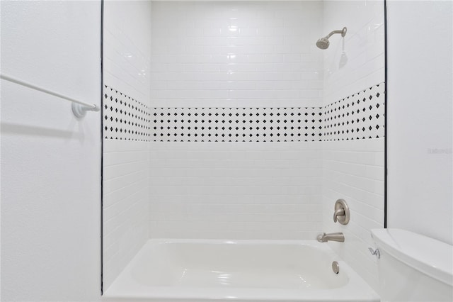 full bathroom featuring bathtub / shower combination and toilet