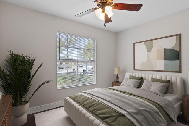 bedroom with baseboards and ceiling fan