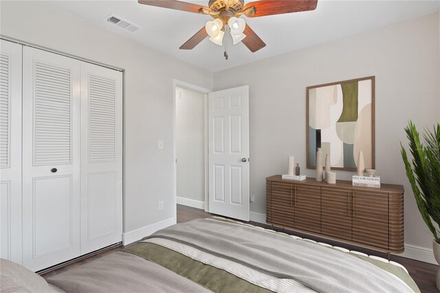 bedroom with a closet, visible vents, a ceiling fan, and baseboards