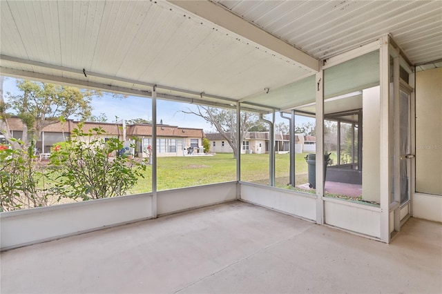 unfurnished sunroom with a residential view