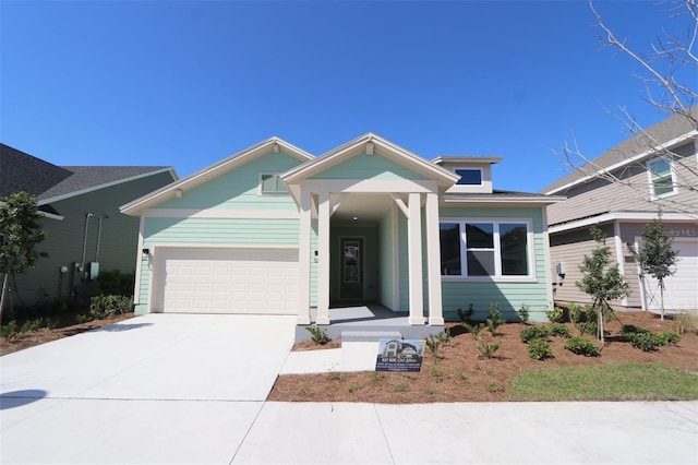 view of front of property with driveway and an attached garage