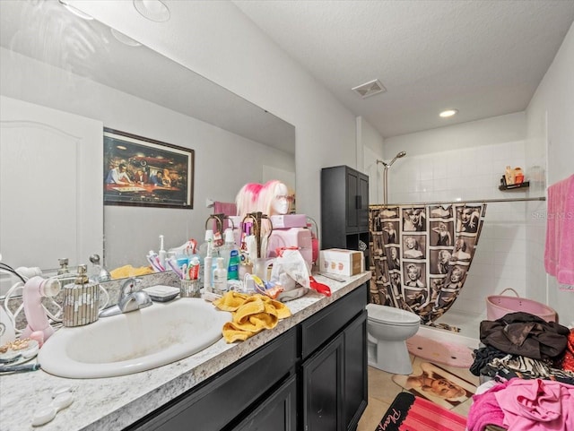 full bathroom featuring tile patterned flooring, visible vents, toilet, a stall shower, and vanity