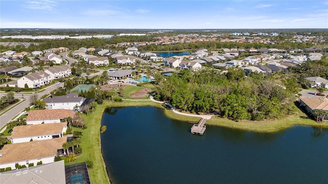 drone / aerial view featuring a residential view and a water view