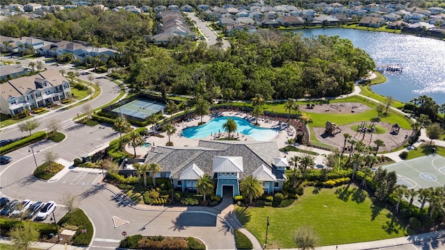 birds eye view of property with a water view and a residential view