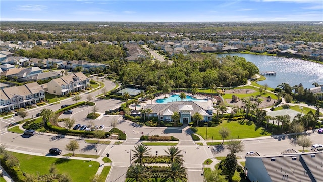 birds eye view of property featuring a residential view and a water view