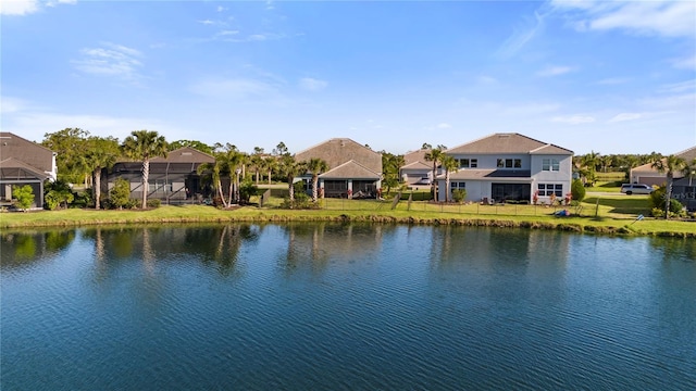 property view of water featuring fence and a residential view