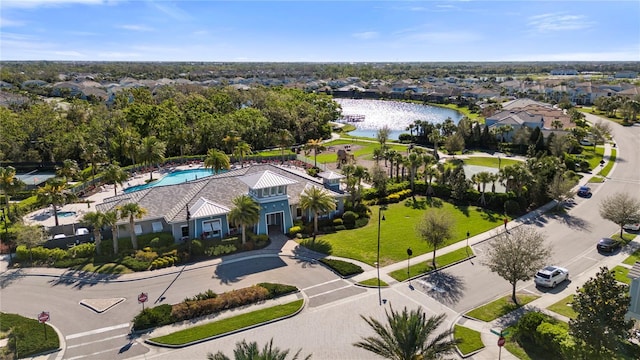 birds eye view of property featuring a residential view and a water view