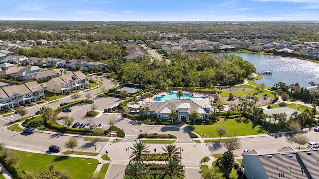 birds eye view of property featuring a water view and a residential view