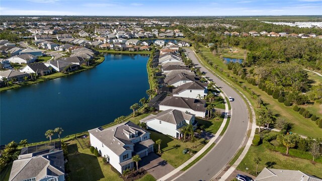 bird's eye view featuring a water view and a residential view