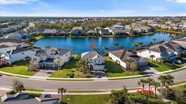 aerial view with a water view and a residential view
