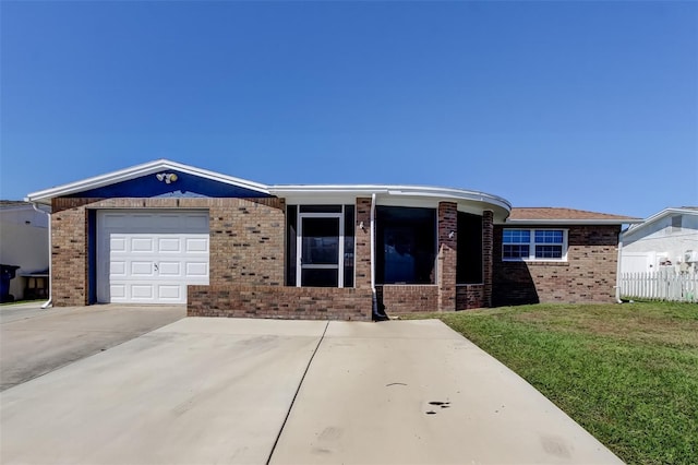 ranch-style home with fence, driveway, a front lawn, a garage, and brick siding