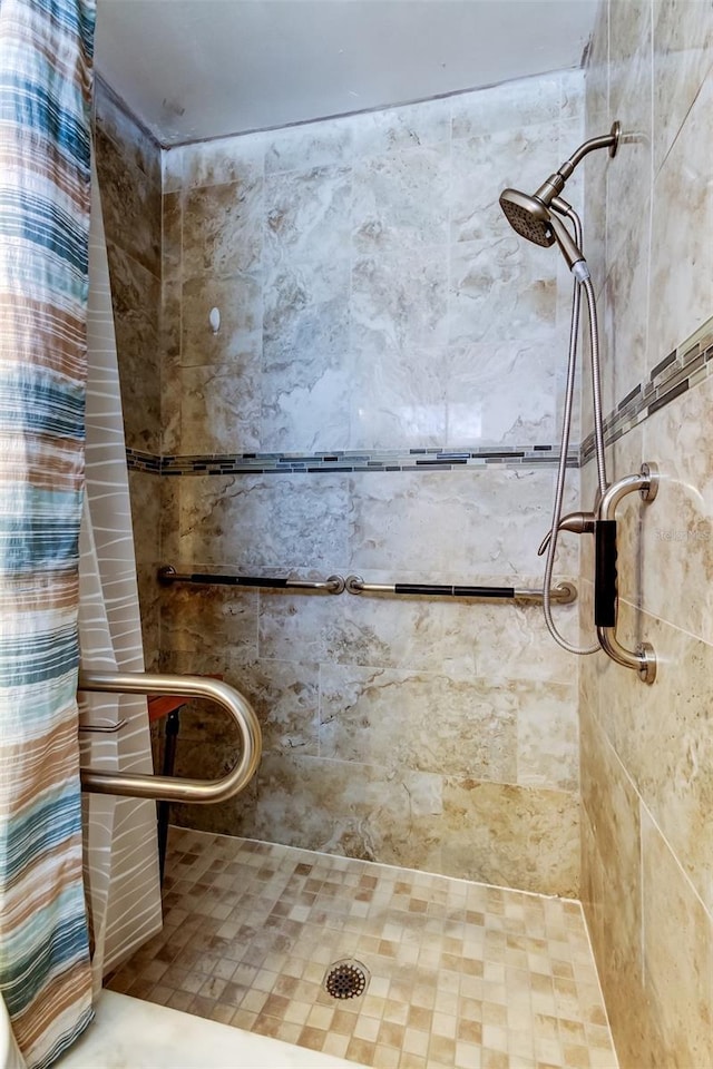 full bath featuring a shower stall