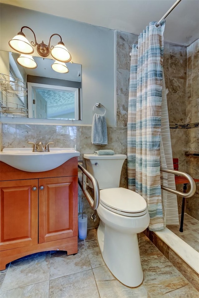 bathroom featuring tiled shower, toilet, tile walls, and vanity