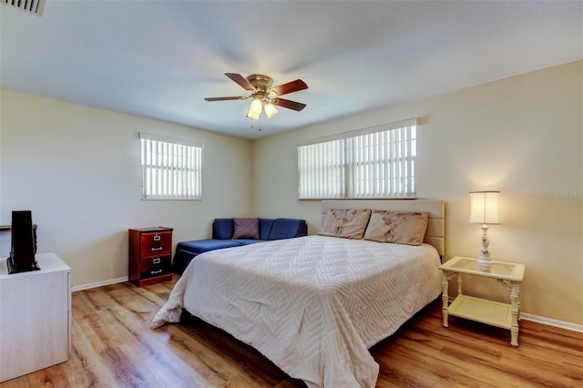 bedroom with visible vents, baseboards, and light wood-style floors