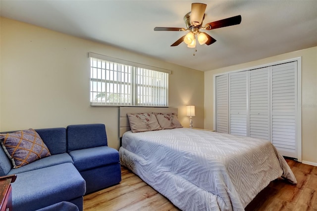 bedroom featuring a closet, ceiling fan, and wood finished floors