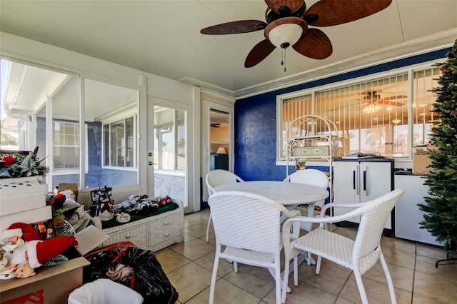 interior space with ceiling fan