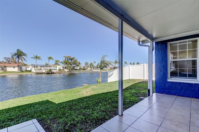 view of yard with fence and a water view