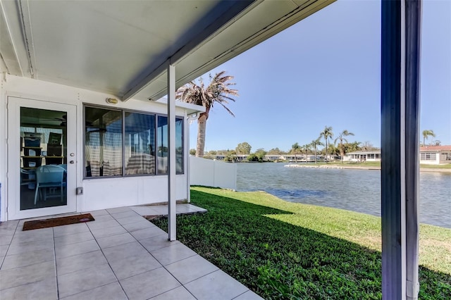 view of yard with a water view and a patio area