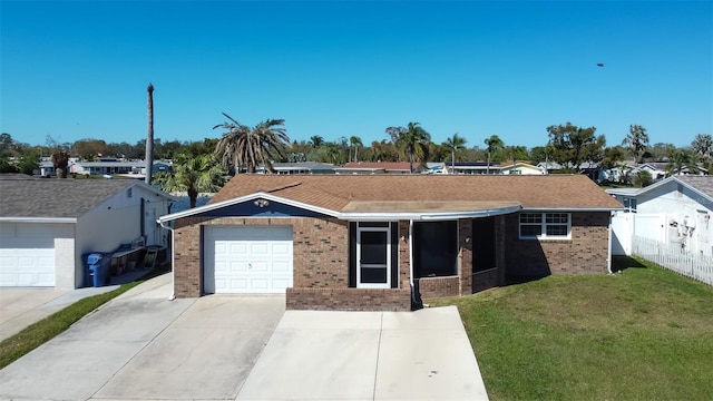 single story home featuring a front lawn, a garage, fence, and brick siding