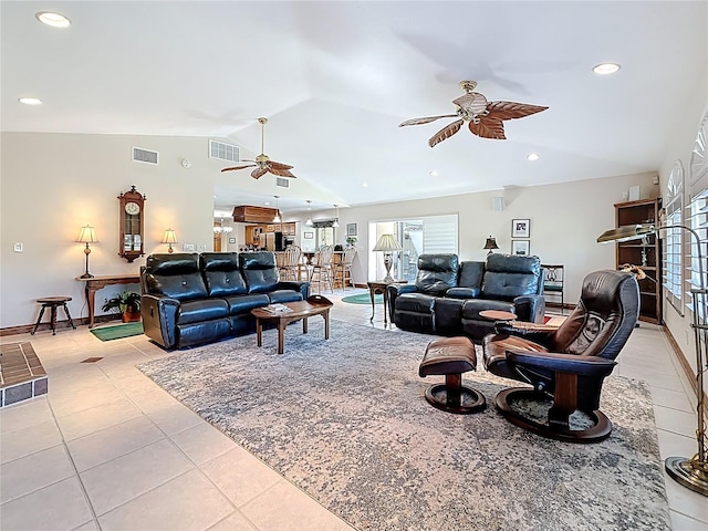 living room with light tile patterned floors, visible vents, ceiling fan, and vaulted ceiling