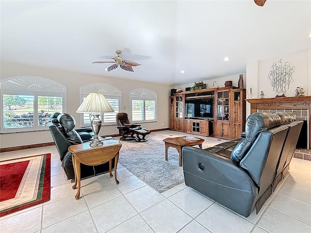 living room featuring recessed lighting, baseboards, ceiling fan, and light tile patterned floors