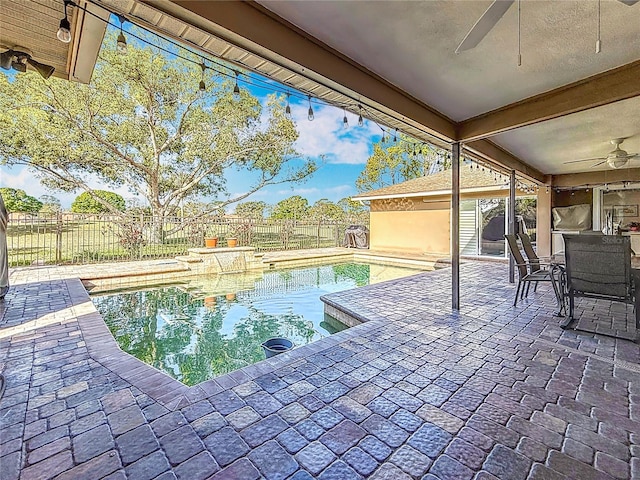 view of pool with a fenced backyard, a patio, and ceiling fan