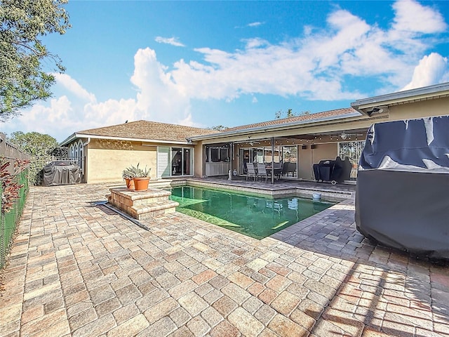 outdoor pool featuring a patio