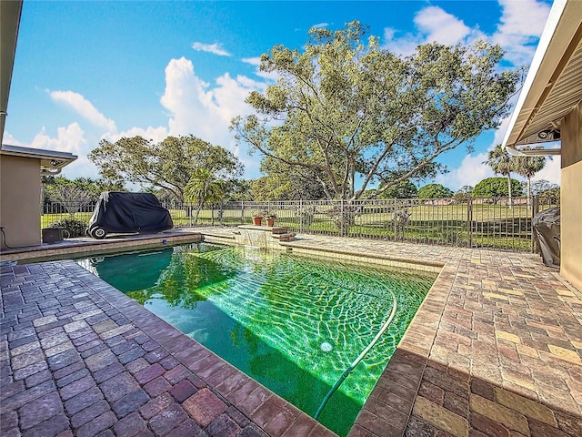 view of pool featuring a fenced in pool, a patio, and a fenced backyard