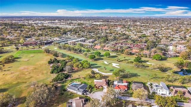 drone / aerial view featuring a residential view and golf course view