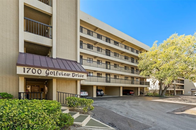 view of property featuring covered parking