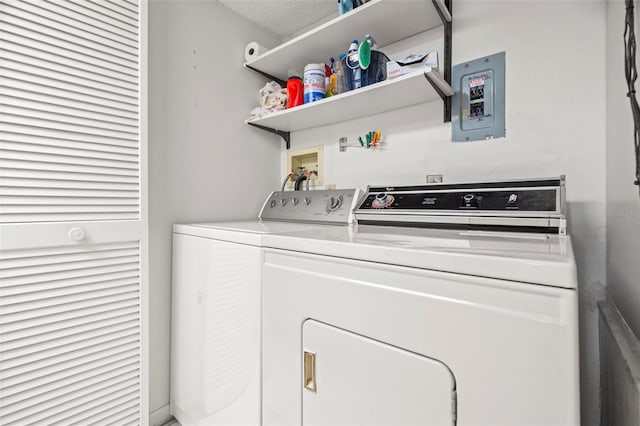 laundry area with washer and dryer, electric panel, and laundry area