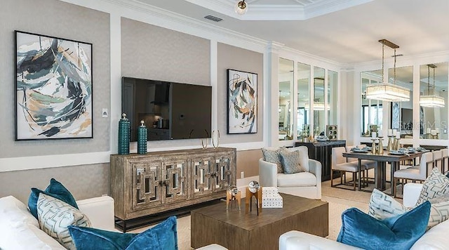 living room with visible vents and crown molding