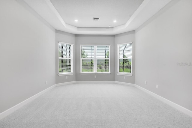 3563 Santa Caterina Blvd, Bradenton, FL 34211 - unfurnished room featuring light carpet, a raised ceiling, baseboards, visible vents, and recessed lighting